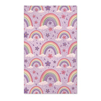 Pastel rainbow nursery area rug on a lilac ground