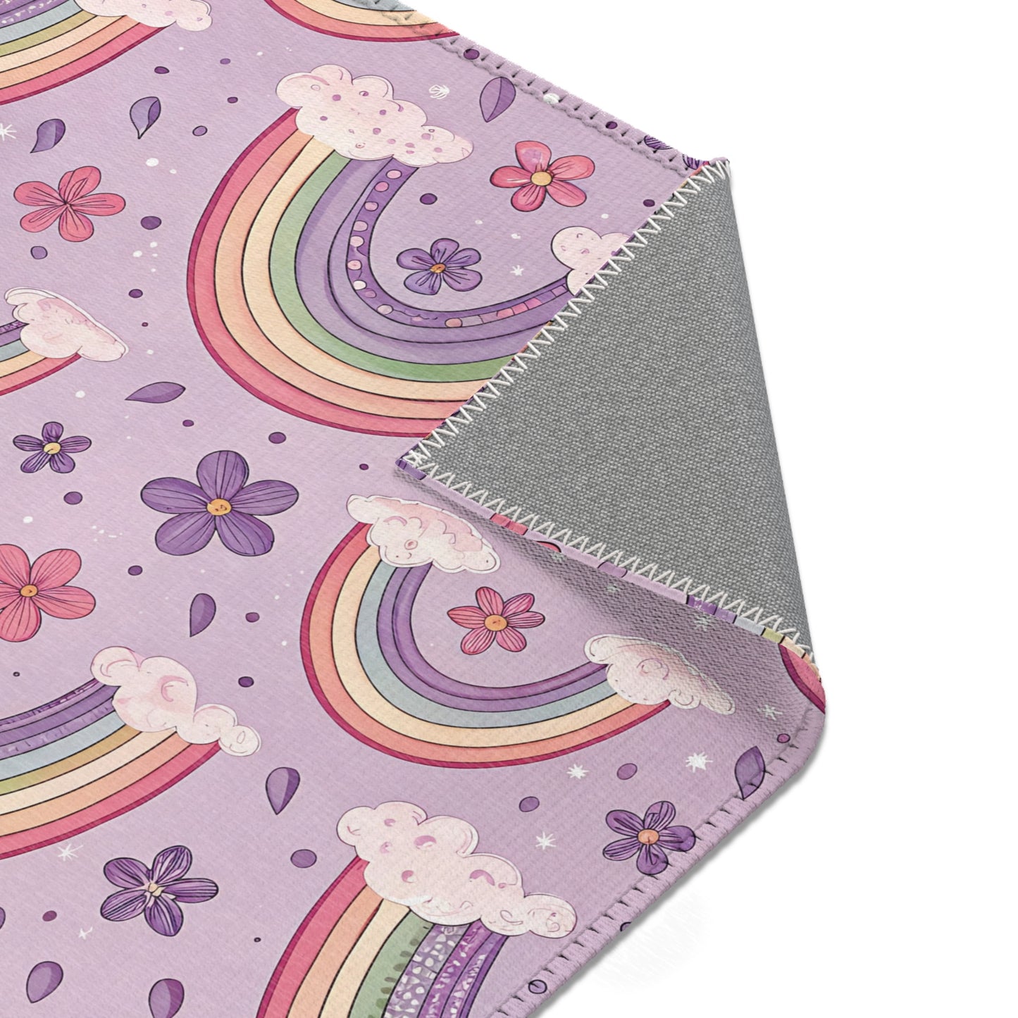 Nursery area rug printed edge to edge with pastel rainbows