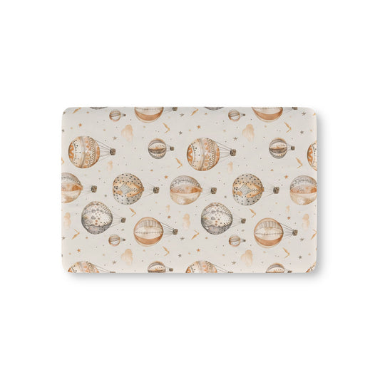 Wandering Balloons fitted crib sheet on a nursery crib mattress