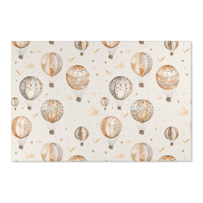 Low pile nursery rug with drifting balloons and clouds