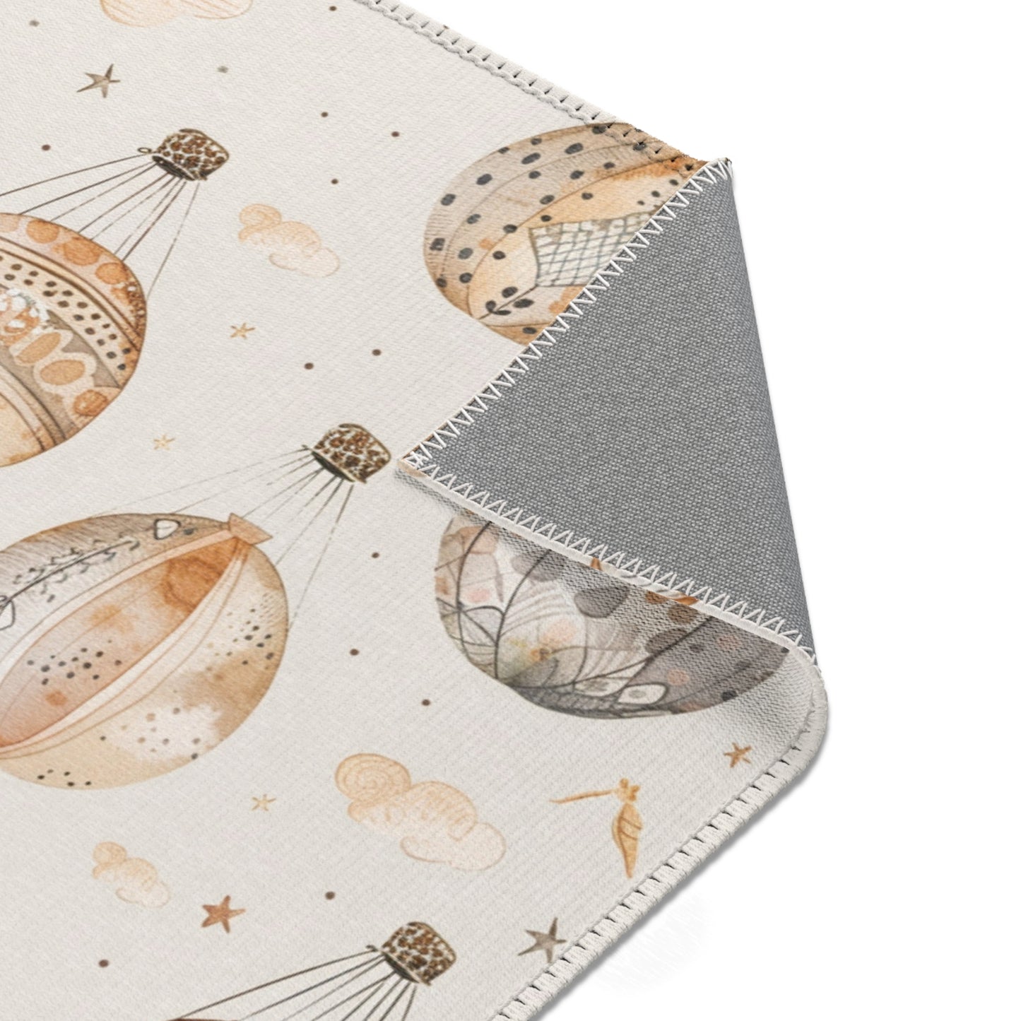 Balloon rug in tan and grey on cream for a nursery floor