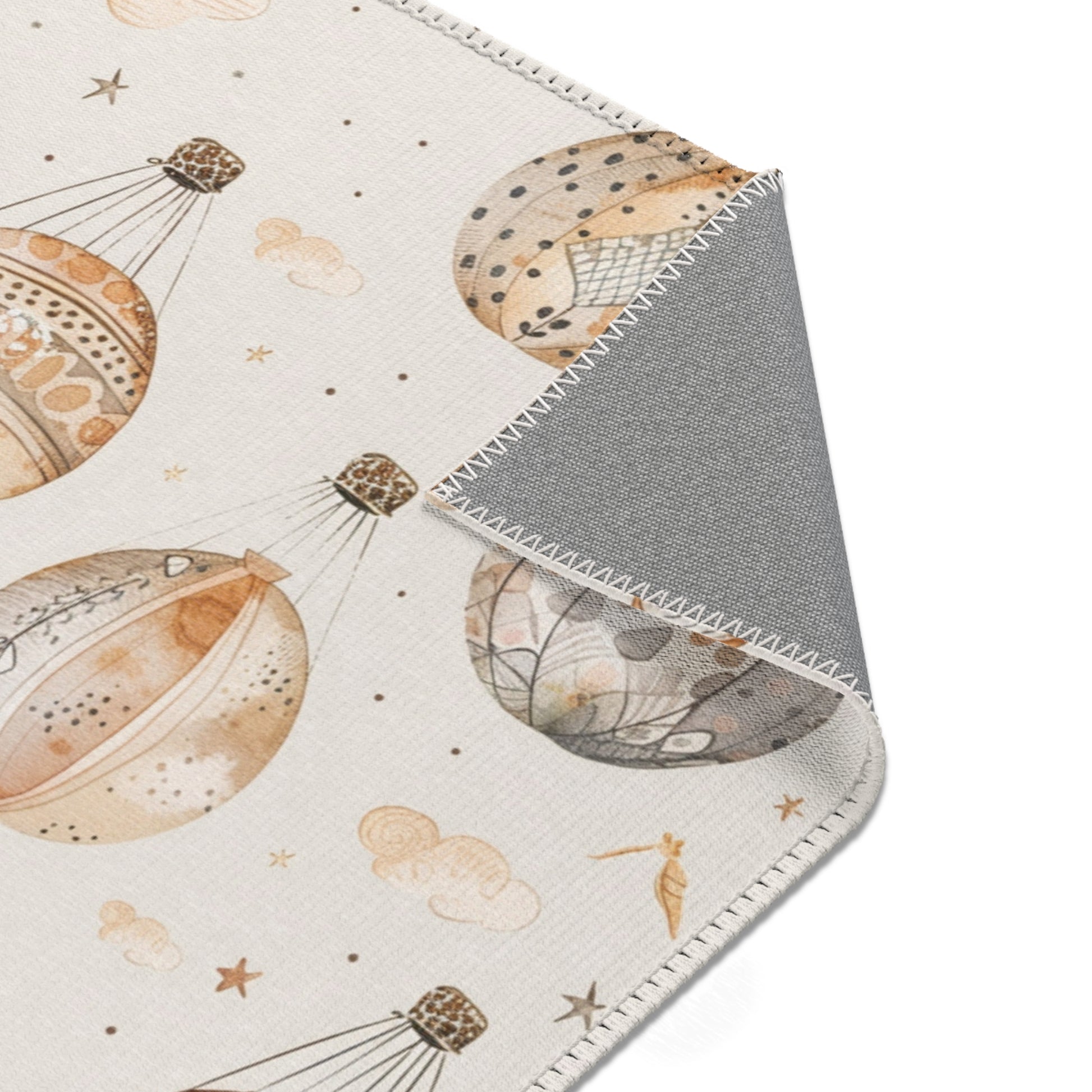 Balloon rug in tan and grey on cream for a nursery floor