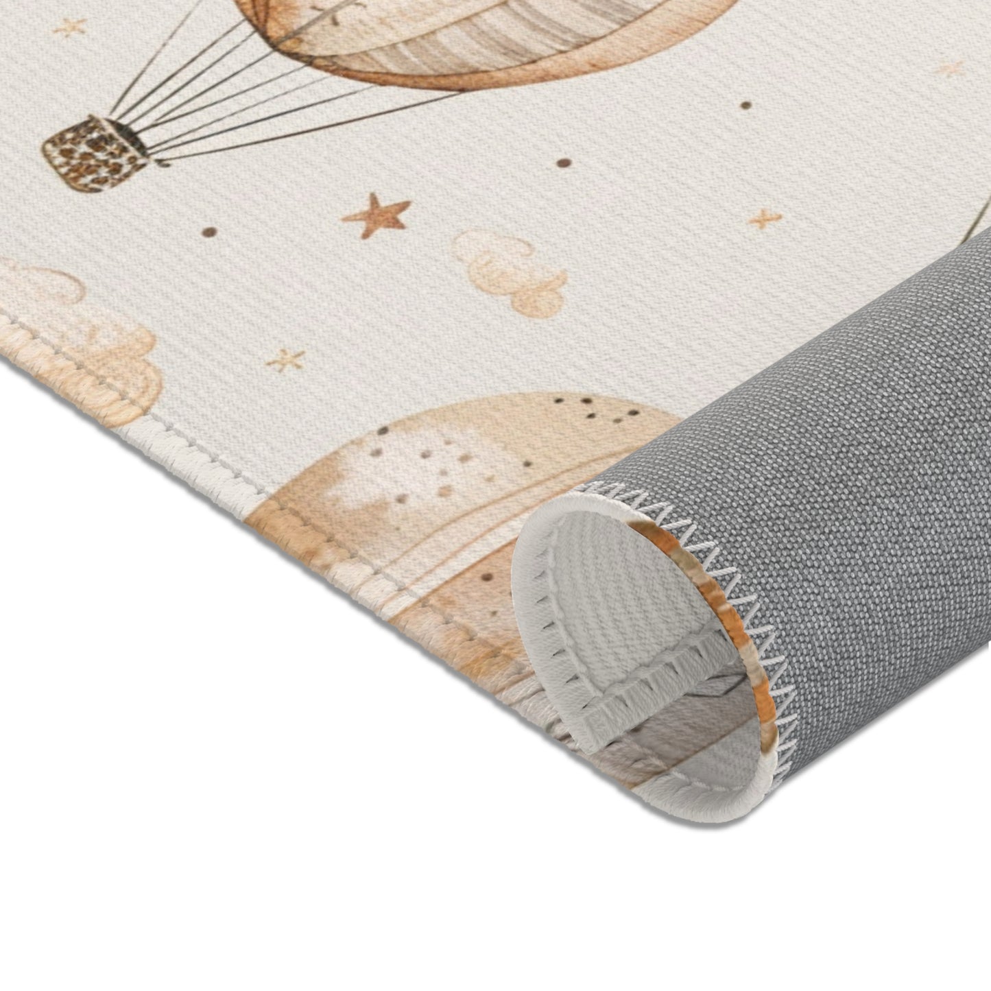 Nursery area rug in a tan, grey and cream palette