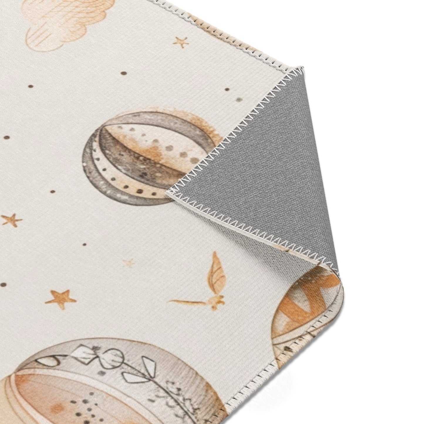 Wandering Balloons rug print detail in tan and soft gold