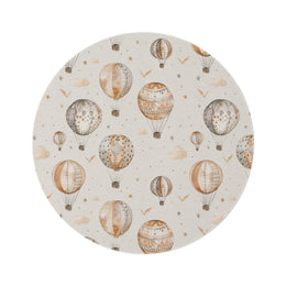 Wandering Balloons round nursery rug on a baby room floor