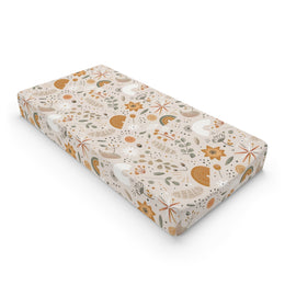 Wildflower Rainbow changing pad cover on a nursery changing table