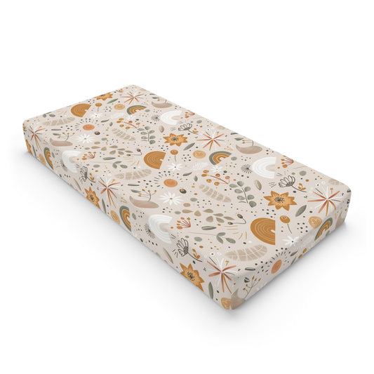 Wildflower Rainbow changing pad cover on a nursery changing table