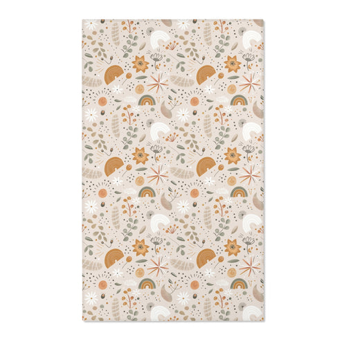 Floral nursery area rug in ochre and sage on warm oat