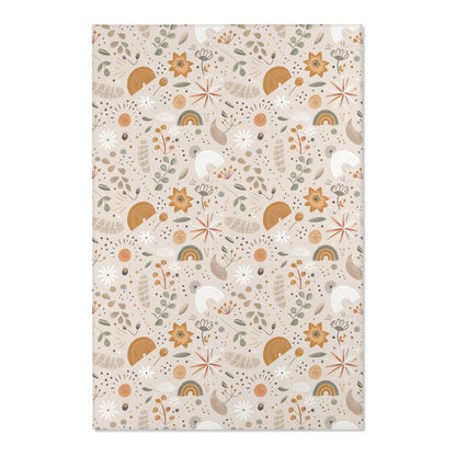 Close detail of the wildflowers and rainbows on the area rug