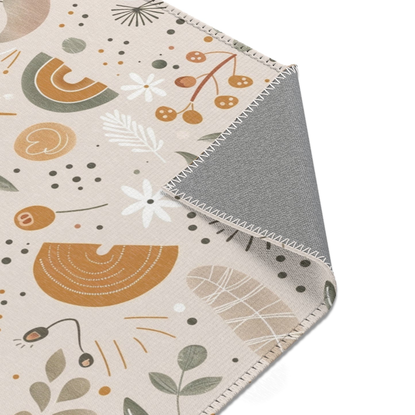 Floral rug in ochre and sage on oat for a nursery floor