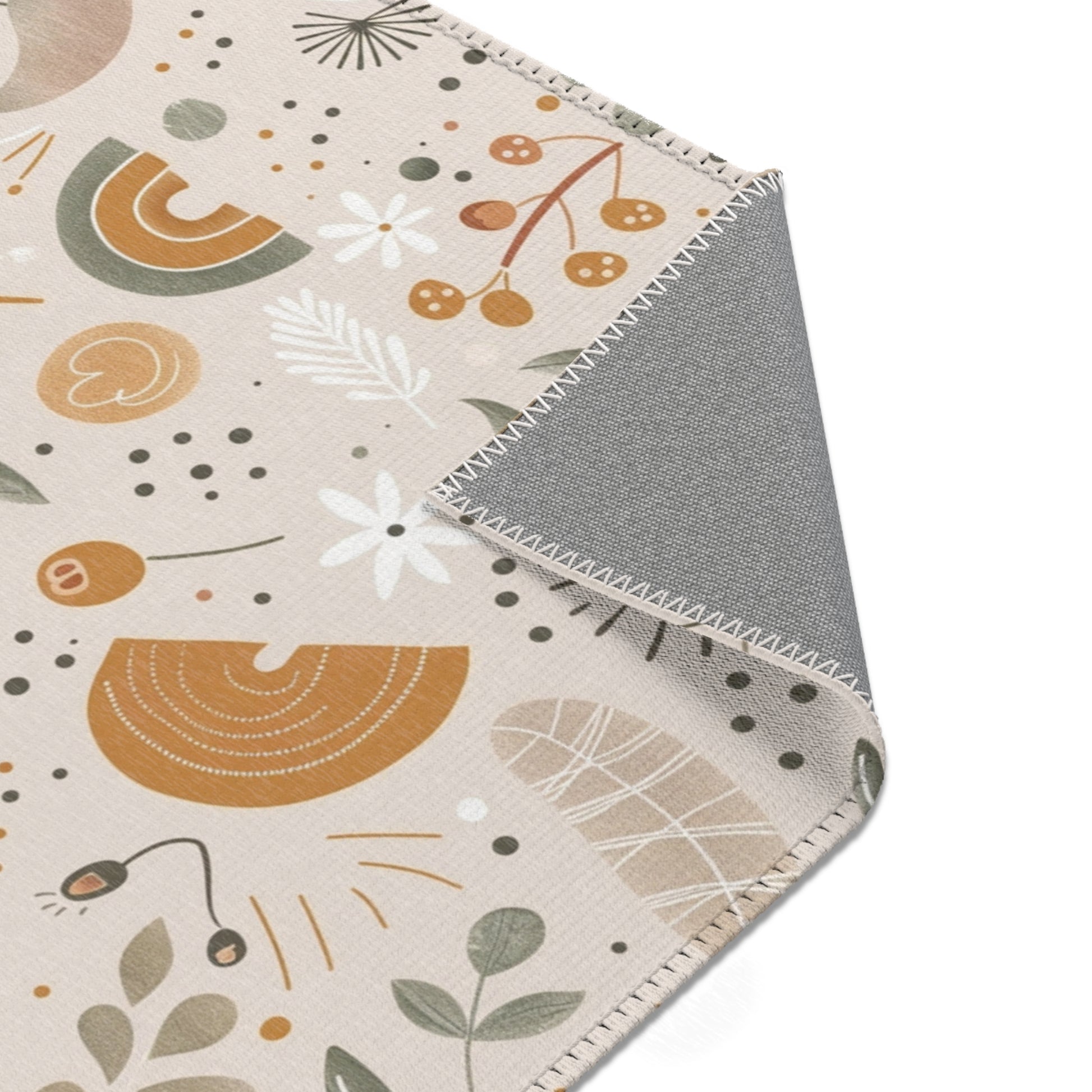 Floral rug in ochre and sage on oat for a nursery floor