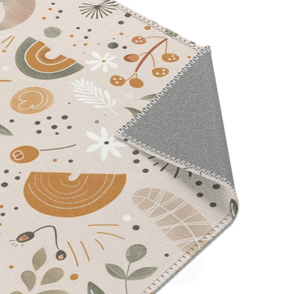 Floral rug in ochre and sage on oat for a nursery floor